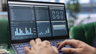 Ambitious leader works in office on infographics reports and setting objectives to drive corporate growth, global investment strategy in a competitive environment. Leadership skills.